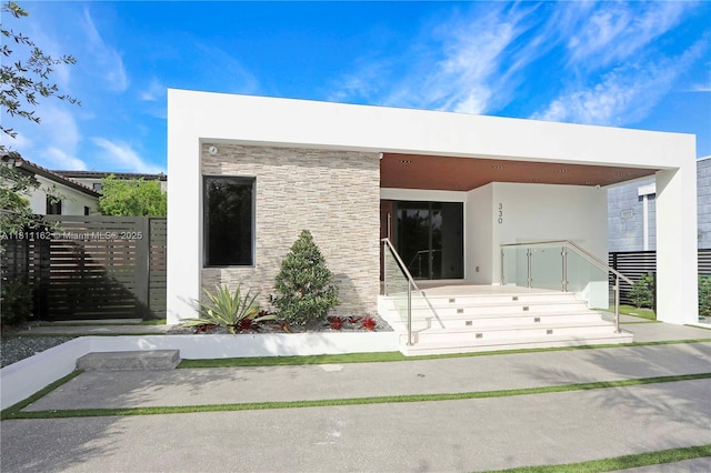 330 SW 19th Rd, Miami, FL 33129 - view of front facade with stucco siding and stone siding