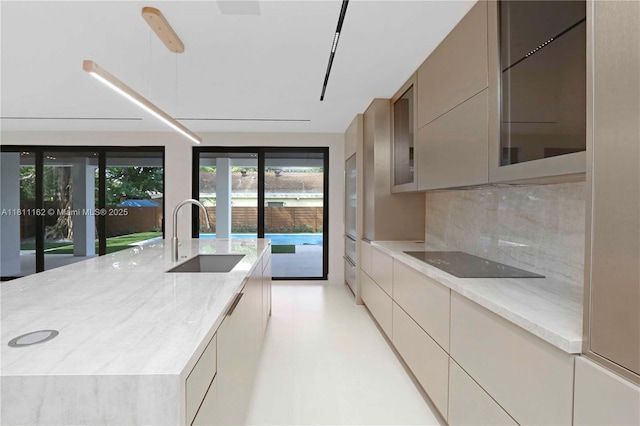 330 SW 19th Rd, Miami, FL 33129 - kitchen with black electric stovetop, modern cabinets, and decorative backsplash