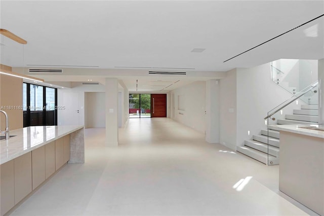 330 SW 19th Rd, Miami, FL 33129 - corridor featuring finished concrete floors, plenty of natural light, and stairway