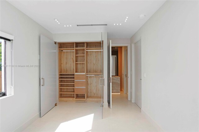 330 SW 19th Rd, Miami, FL 33129 - unfurnished bedroom featuring a closet and baseboards