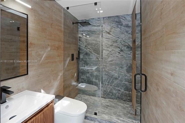 330 SW 19th Rd, Miami, FL 33129 - bathroom featuring vanity, tile walls, and a shower stall