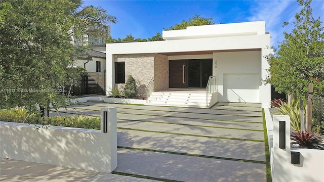 330 SW 19th Rd, Miami, FL 33129 - contemporary house featuring stucco siding and stone siding