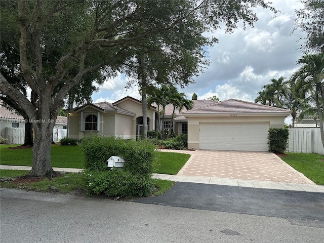 13220 NW 11th Ct, Sunrise, FL 33323 - ranch-style home with driveway, a garage, stucco siding, and a tiled roof