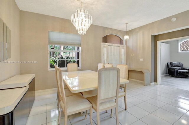 13220 NW 11th Ct, Sunrise, FL 33323 - dining space with a chandelier and light tile patterned floors