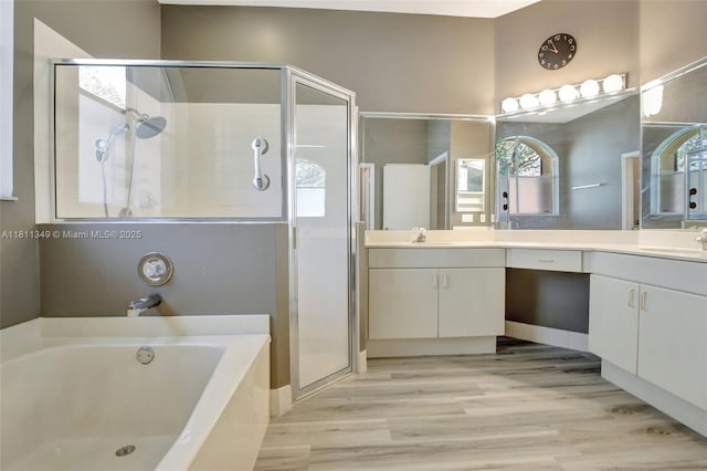 13220 NW 11th Ct, Sunrise, FL 33323 - bathroom with a shower stall, a bath, vanity, and wood finished floors