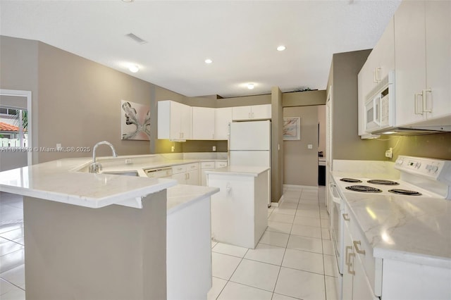 13220 NW 11th Ct, Sunrise, FL 33323 - kitchen with white appliances, a center island, light tile patterned floors, a peninsula, and a kitchen breakfast bar