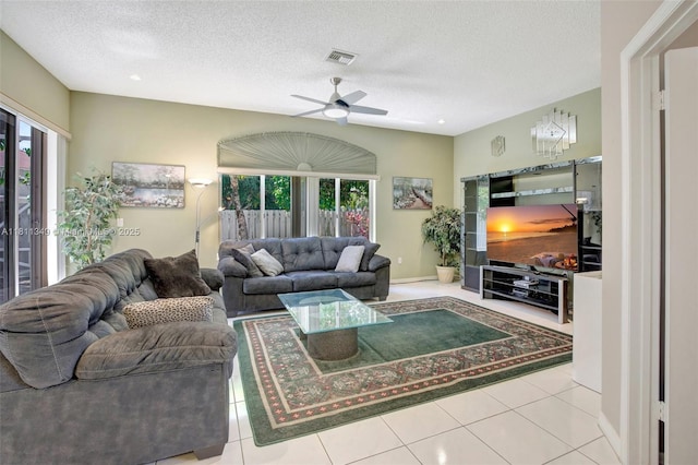 13220 NW 11th Ct, Sunrise, FL 33323 - tiled living area featuring healthy amount of natural light, ceiling fan, and a textured ceiling