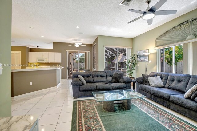 13220 NW 11th Ct, Sunrise, FL 33323 - living room featuring ceiling fan, a textured ceiling, light tile patterned floors, and recessed lighting