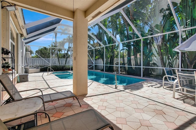 13220 NW 11th Ct, Sunrise, FL 33323 - view of pool featuring glass enclosure, a fenced backyard, a patio area, and a pool with connected hot tub