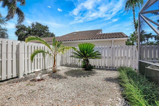 13220 NW 11th Ct, Sunrise, FL 33323 - fenced backyard featuring glass enclosure