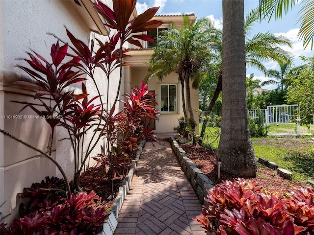 1030 Bamboo Ln, Weston, FL 33327 - view of side of home featuring stucco siding
