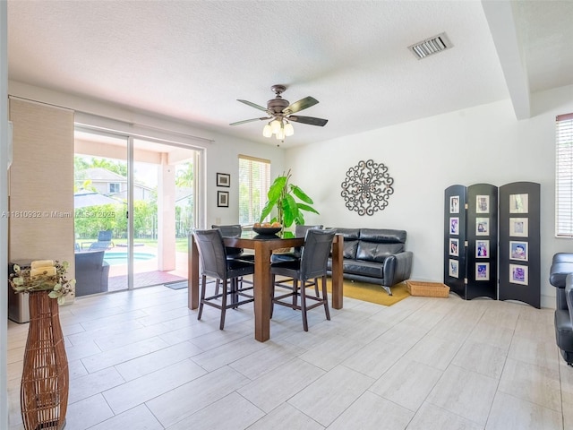 1030 Bamboo Ln, Weston, FL 33327 - dining area with a ceiling fan and a textured ceiling