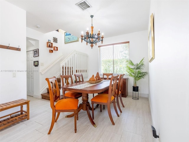 1030 Bamboo Ln, Weston, FL 33327 - dining area featuring stairway, a chandelier, and light wood-style flooring