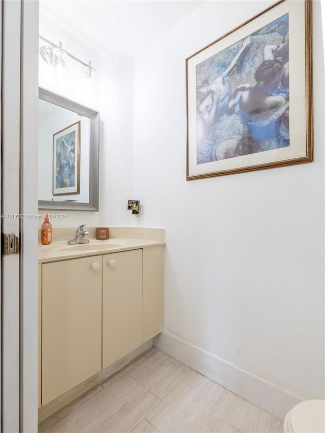 1030 Bamboo Ln, Weston, FL 33327 - half bathroom with vanity, toilet, and baseboards