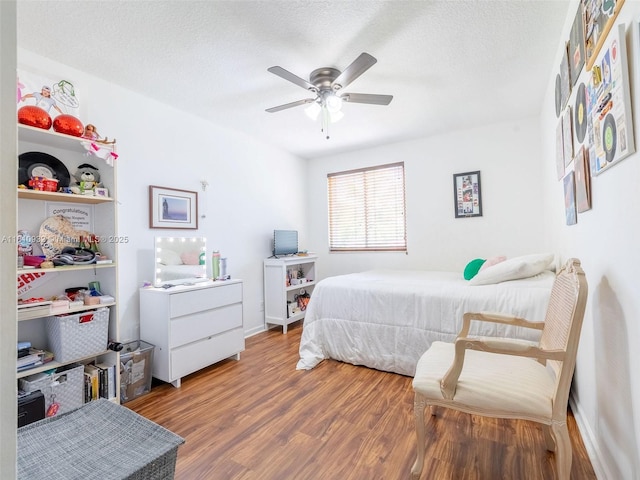 1030 Bamboo Ln, Weston, FL 33327 - bedroom with wood finished floors, a textured ceiling, and ceiling fan