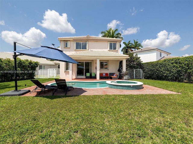 1030 Bamboo Ln, Weston, FL 33327 - rear view of house featuring stucco siding, a patio, a tiled roof, and a pool with connected hot tub