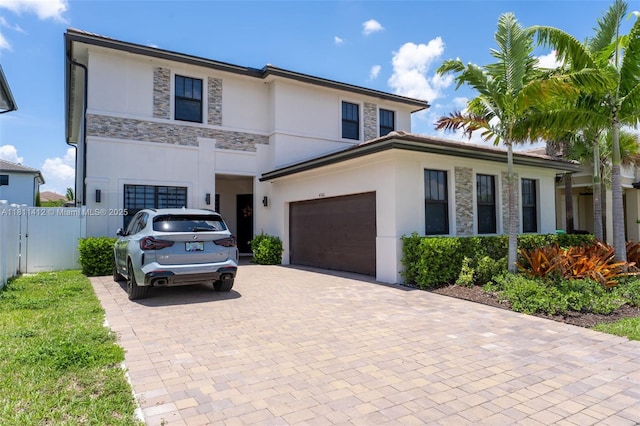 4366 SW 174th Ave, Miramar, FL 33029 - view of front of home with stucco siding, stone siding, and decorative driveway