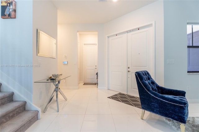 4366 SW 174th Ave, Miramar, FL 33029 - entryway featuring stairway, baseboards, and light tile patterned flooring