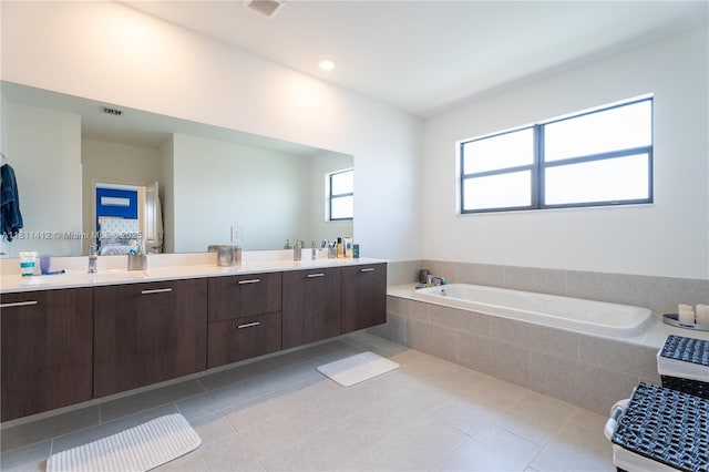 4366 SW 174th Ave, Miramar, FL 33029 - full bath featuring a garden tub, double vanity, tile patterned floors, and plenty of natural light