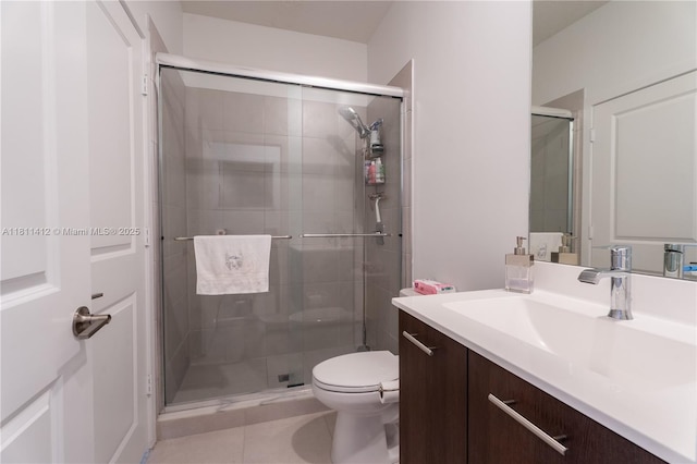 4366 SW 174th Ave, Miramar, FL 33029 - full bathroom featuring vanity, toilet, a shower stall, and tile patterned flooring