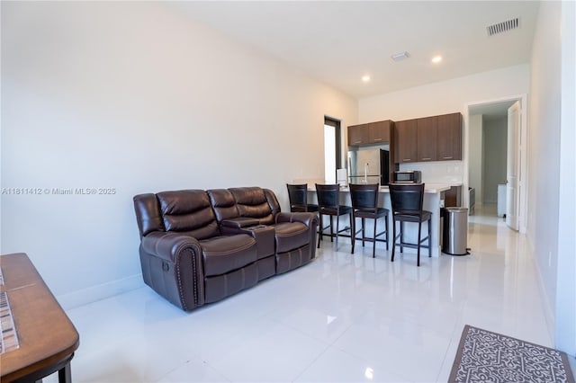 4366 SW 174th Ave, Miramar, FL 33029 - living area featuring light tile patterned flooring, recessed lighting, and baseboards