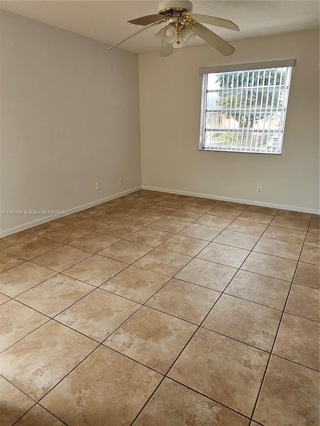 8475 SW 156th Ct Unit 321, Miami, FL 33193 - empty room with light tile patterned floors, a ceiling fan, and baseboards