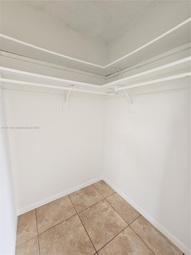 8475 SW 156th Ct Unit 321, Miami, FL 33193 - walk in closet featuring light tile patterned floors