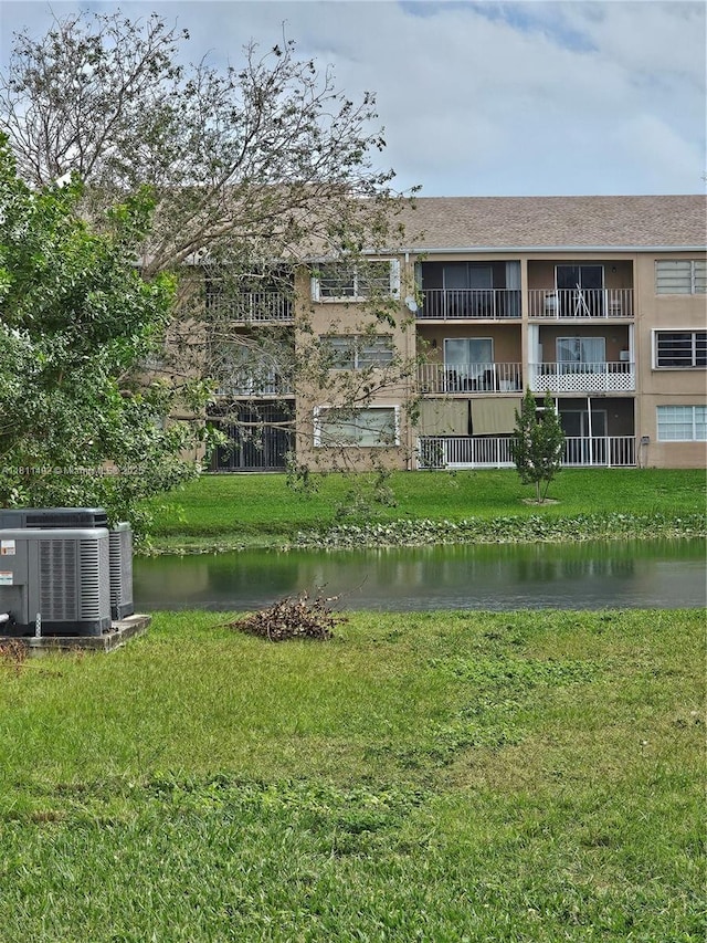 8475 SW 156th Ct Unit 321, Miami, FL 33193 - view of building exterior with central air condition unit and a water view