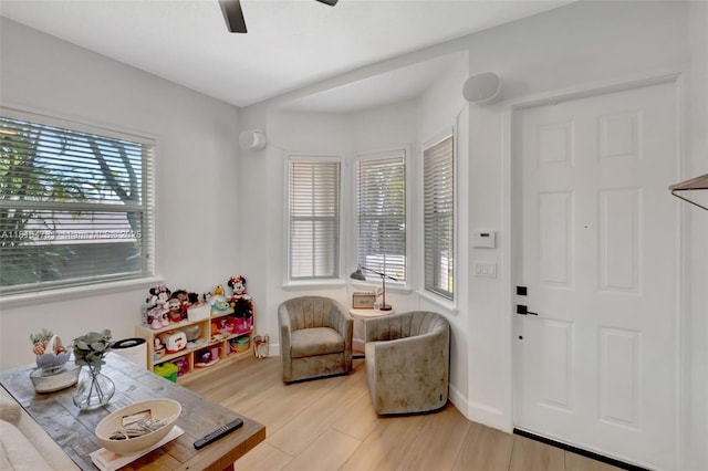4413 NW 97th Pl, Doral, FL 33178 - living room with a raised ceiling, a barn door, ceiling fan, and light wood finished floors