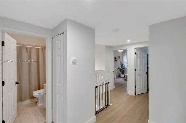 4413 NW 97th Pl, Doral, FL 33178 - hall featuring an upstairs landing, wood finished floors, baseboards, and recessed lighting