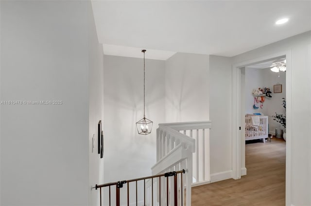 4413 NW 97th Pl, Doral, FL 33178 - corridor featuring an upstairs landing, light wood-style flooring, recessed lighting, and baseboards