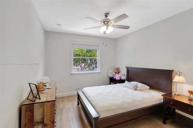 4413 NW 97th Pl, Doral, FL 33178 - bedroom featuring light wood-style flooring, baseboards, and a ceiling fan