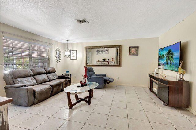 4035 N 110th Ave N, West Palm Beach, FL 33411 - living room featuring a textured ceiling and baseboards