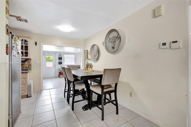4035 N 110th Ave N, West Palm Beach, FL 33411 - dining space featuring light tile patterned floors and baseboards