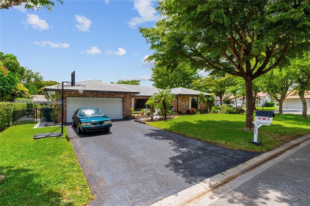 988 NW 110th Ave, Coral Springs, FL 33071 - ranch-style home with driveway and a garage
