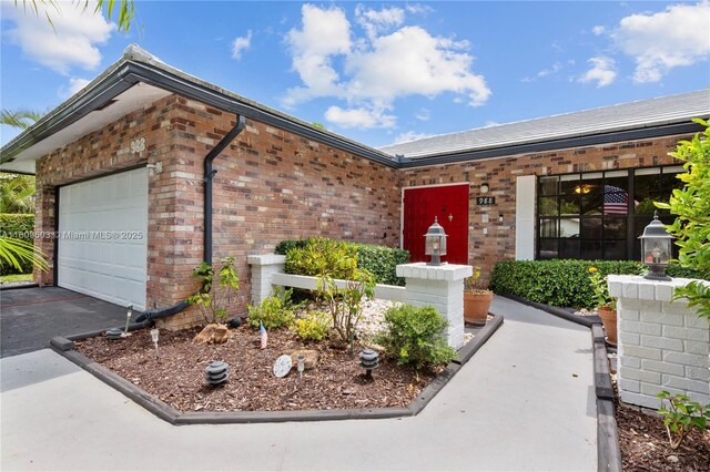 988 NW 110th Ave, Coral Springs, FL 33071 - ranch-style home featuring brick siding, a garage, and driveway