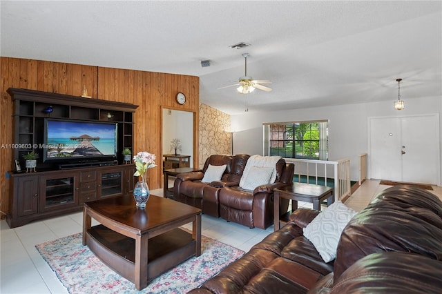 988 NW 110th Ave, Coral Springs, FL 33071 - living area with wood walls, vaulted ceiling, ceiling fan, light tile patterned floors, and an accent wall