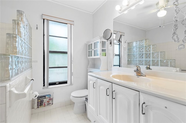 988 NW 110th Ave, Coral Springs, FL 33071 - bathroom with toilet, vanity, crown molding, ceiling fan, and tile patterned flooring