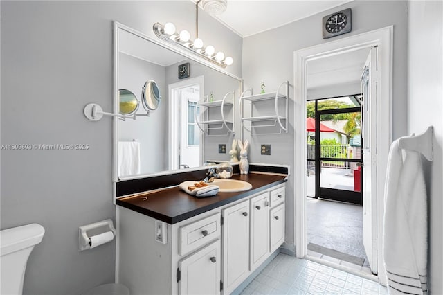 988 NW 110th Ave, Coral Springs, FL 33071 - bathroom with toilet, vanity, and tile patterned floors