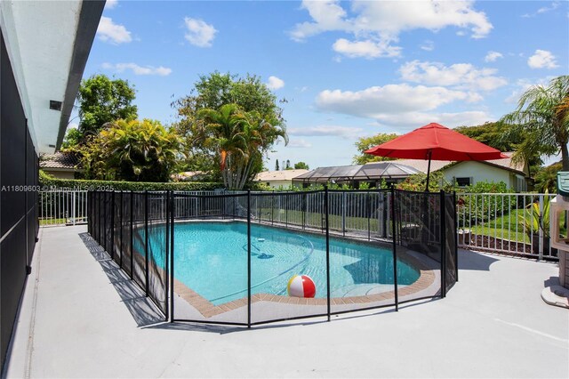 988 NW 110th Ave, Coral Springs, FL 33071 - view of swimming pool featuring a patio