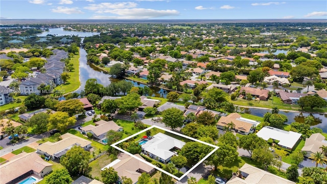 988 NW 110th Ave, Coral Springs, FL 33071 - aerial view of residential area with a large body of water and property boundaries highlighted