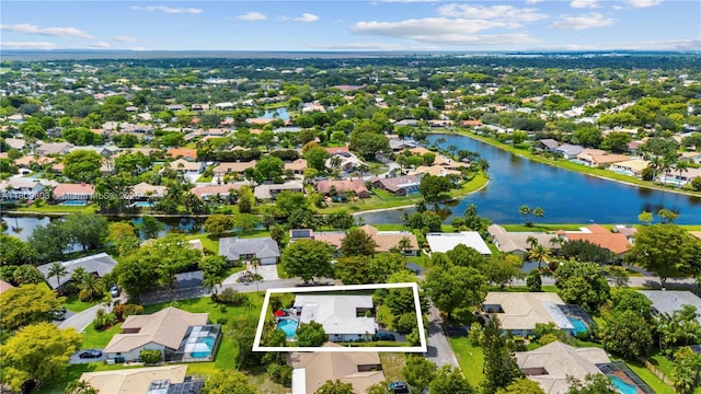 988 NW 110th Ave, Coral Springs, FL 33071 - aerial view of residential area featuring property boundaries highlighted and a large body of water