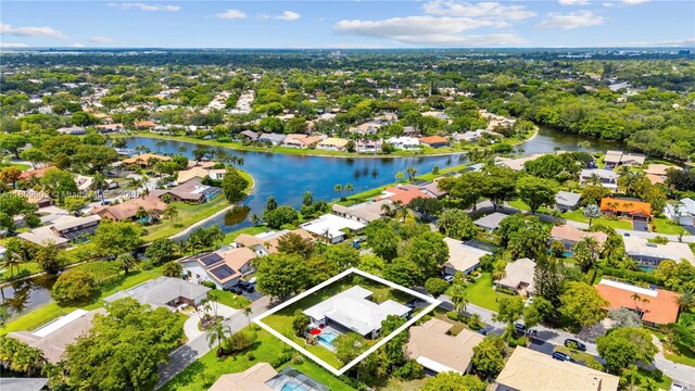 988 NW 110th Ave, Coral Springs, FL 33071 - aerial view of residential area featuring property parcel outlined and a nearby body of water