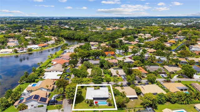 988 NW 110th Ave, Coral Springs, FL 33071 - aerial view of residential area with property boundaries highlighted and a large body of water