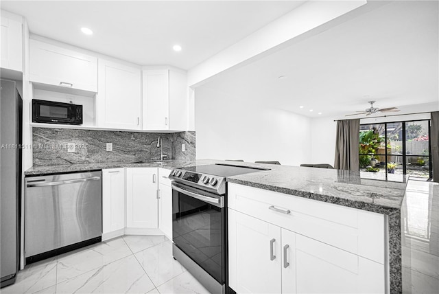 132 S Cypress Rd Unit 518, Pompano Beach, FL 33060 - kitchen featuring stainless steel appliances, a peninsula, light marble finish floors, stone countertops, and recessed lighting
