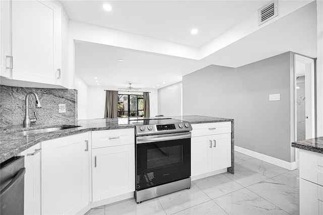 132 S Cypress Rd Unit 518, Pompano Beach, FL 33060 - kitchen featuring stainless steel appliances, light marble finish flooring, a peninsula, white cabinets, and dark stone countertops