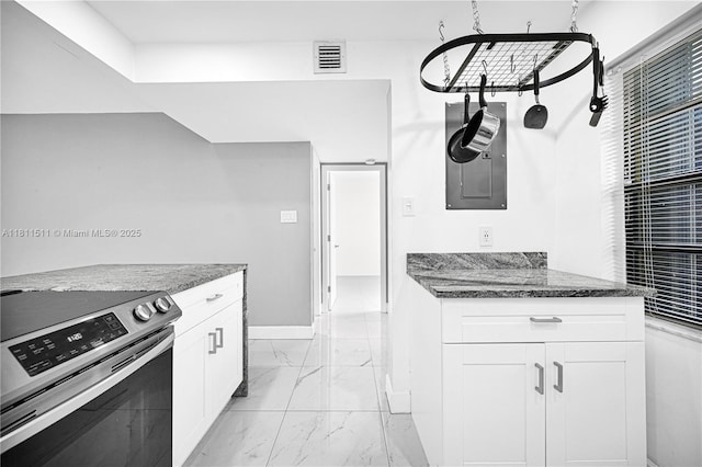 132 S Cypress Rd Unit 518, Pompano Beach, FL 33060 - kitchen featuring stainless steel range with electric stovetop, light marble finish flooring, dark stone counters, white cabinetry, and electric panel