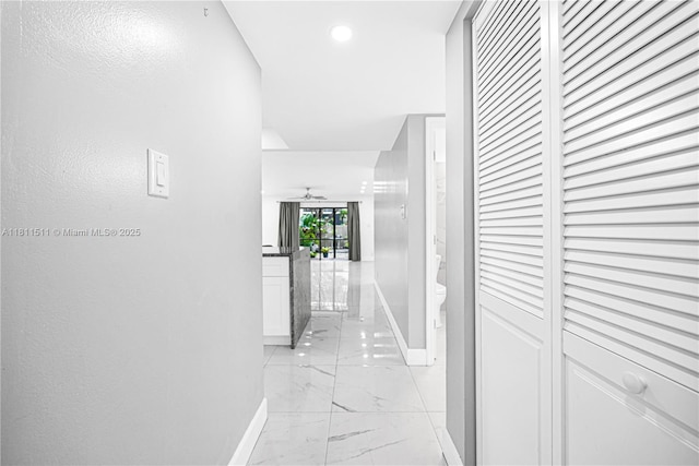 132 S Cypress Rd Unit 518, Pompano Beach, FL 33060 - hallway featuring light marble finish floors and recessed lighting