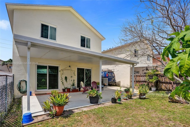 13780 SW 160th Ter, Miami, FL 33177 - back of house with stucco siding and a patio