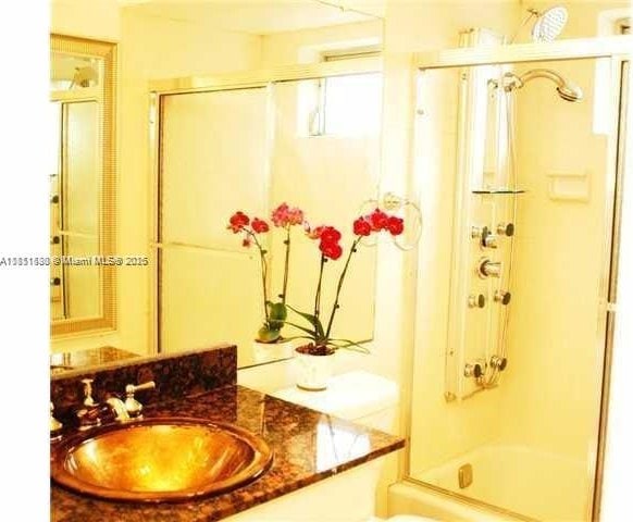 2431 SW 82nd Ave Unit 205, Davie, FL 33324 - full bath featuring vanity and bath / shower combo with glass door